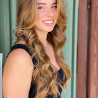 Long honey curls styled for an event